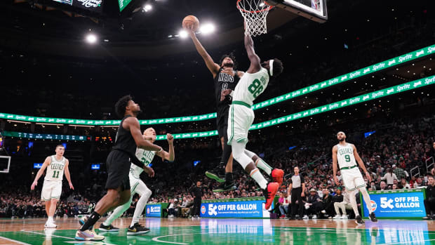  Brooklyn Nets forward Trendon Watford (9) shoots against Boston Celtics center Neemias Queta (88) in the second half at TD Garden.